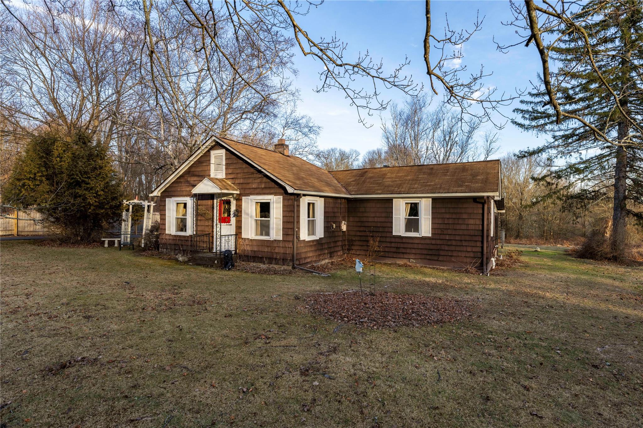 View of front of house with a front yard