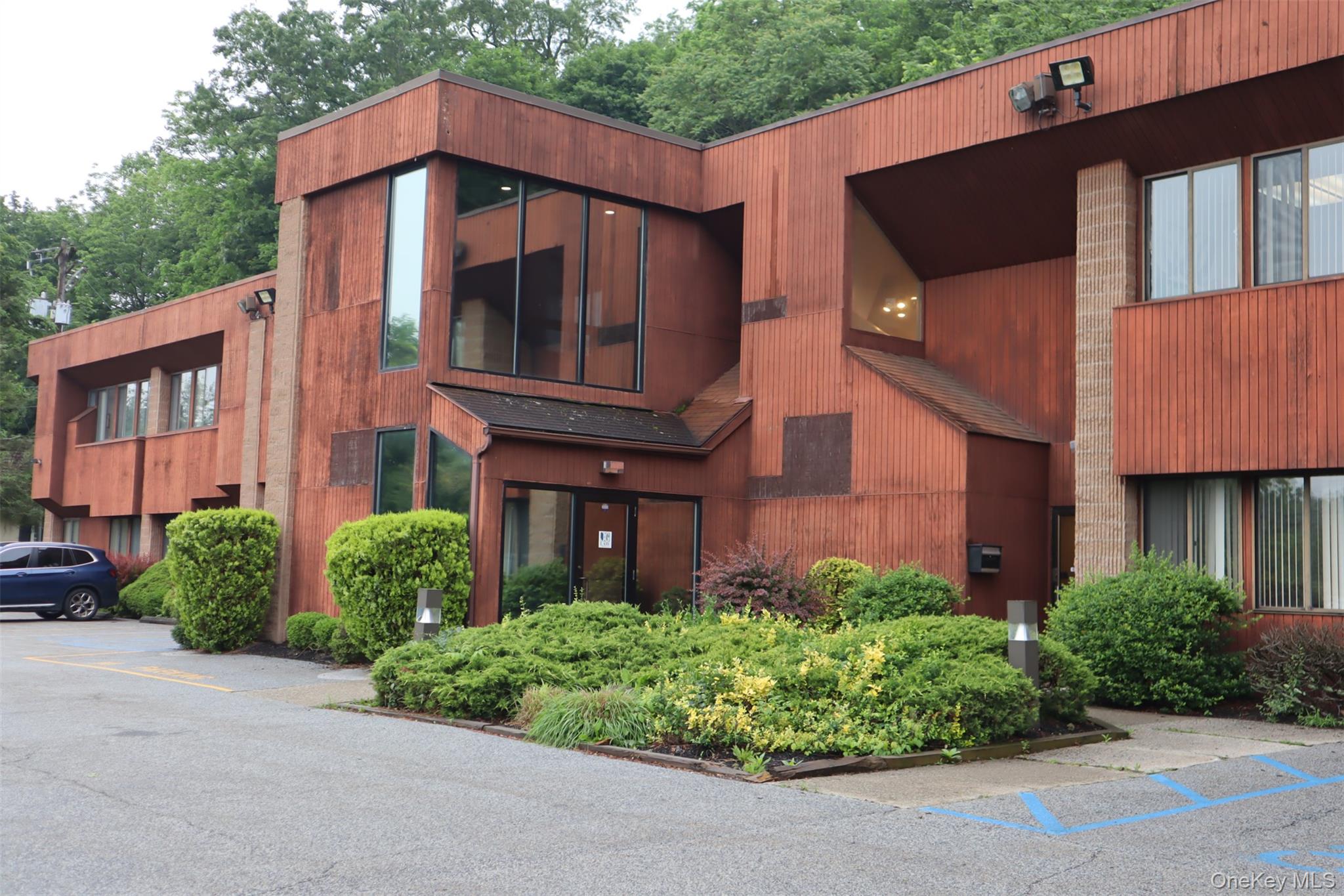 View of property with uncovered parking