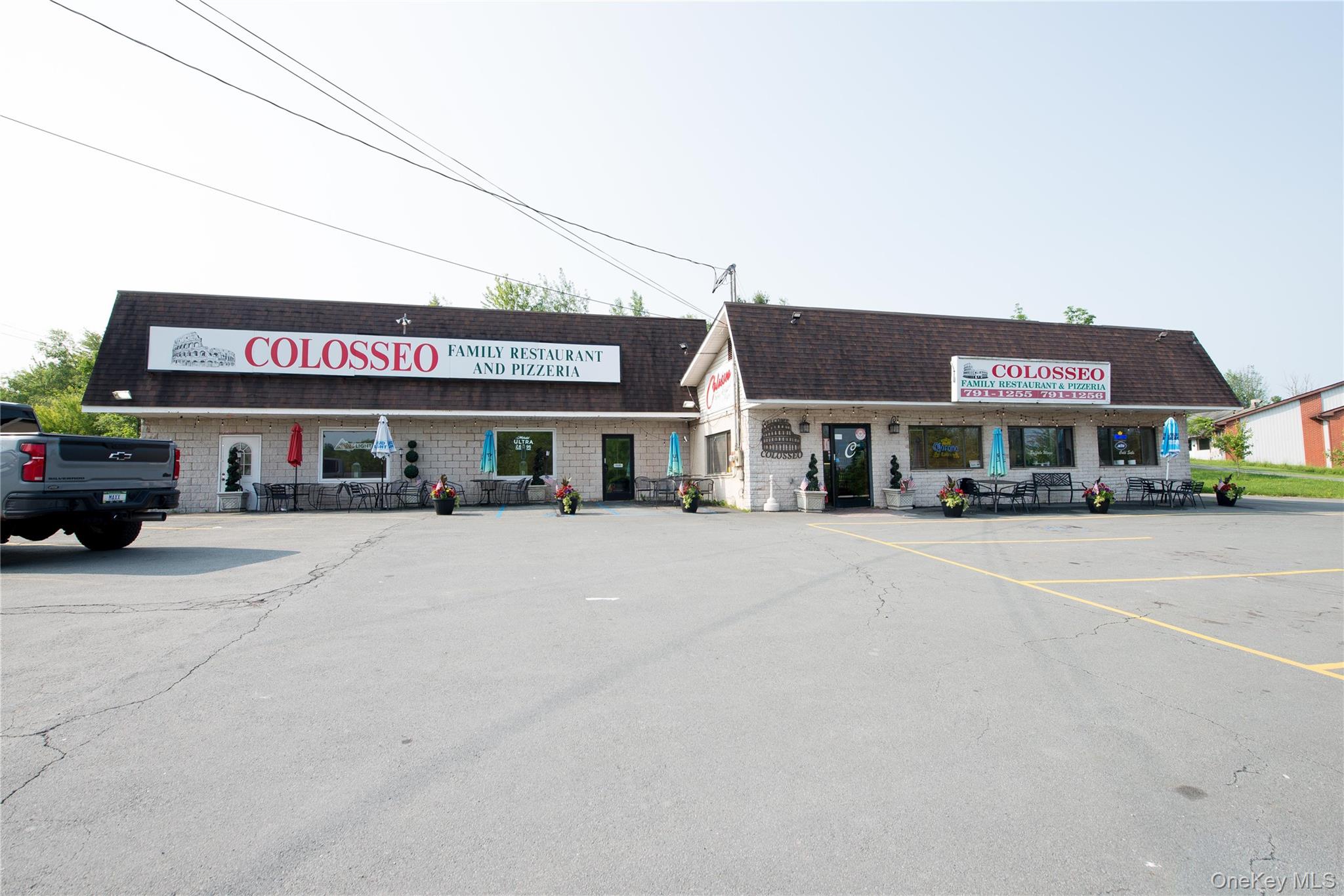 View of commercial location with uncovered parking