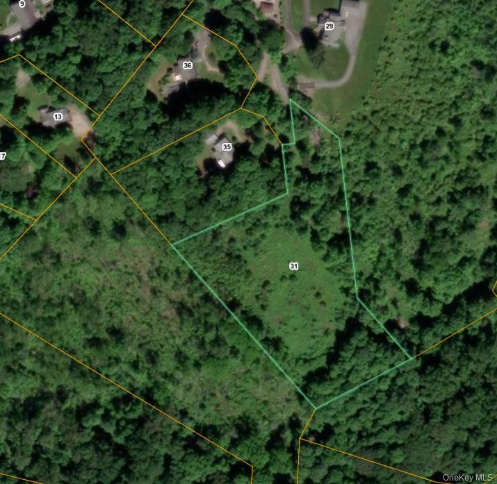 Aerial map of property and surrounding area featuring property boundaries highlighted