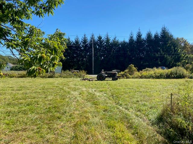 View of grassy yard with a view of countryside