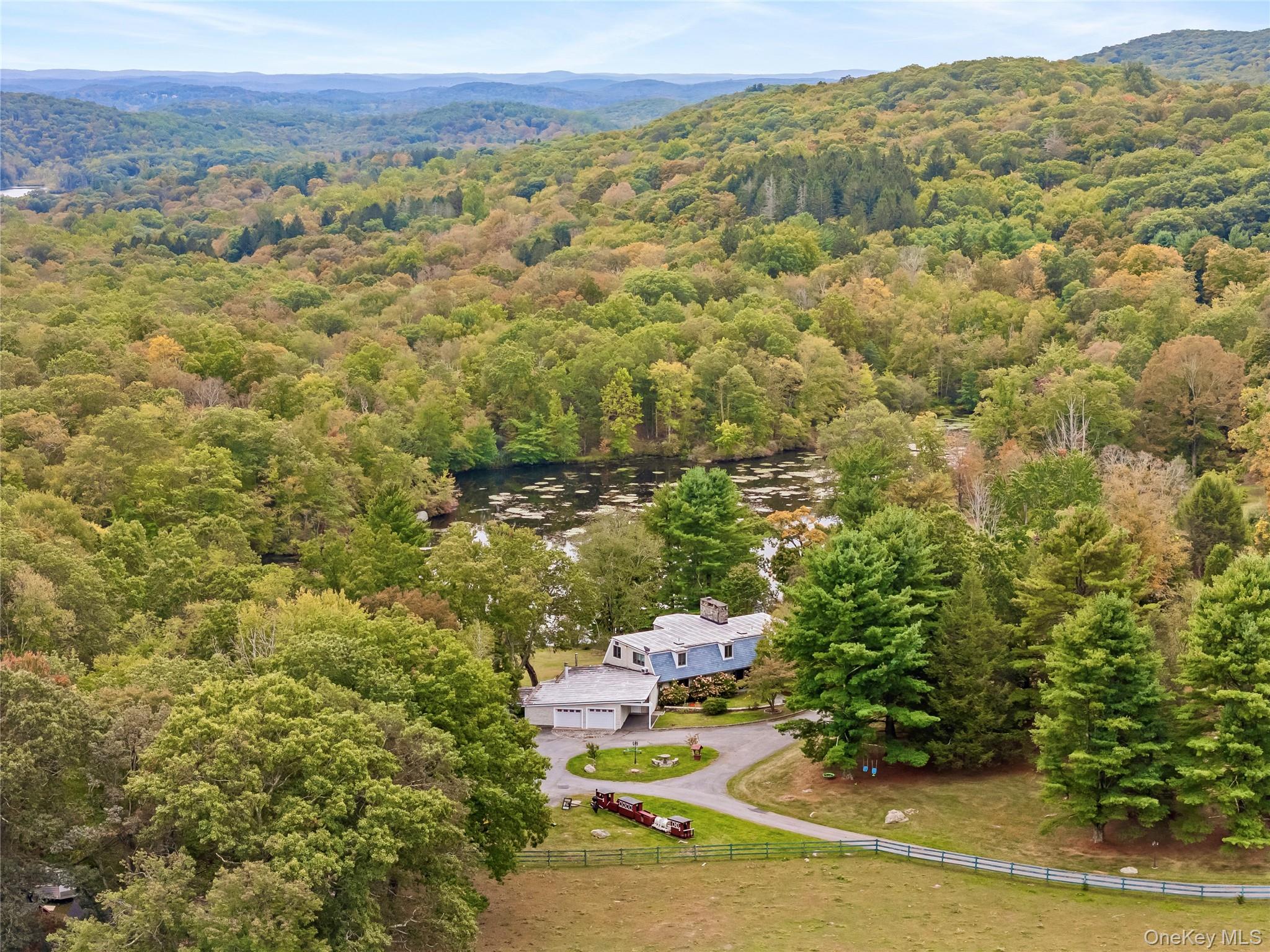 View from above of property featuring a forest