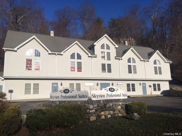 View of front of property with uncovered parking