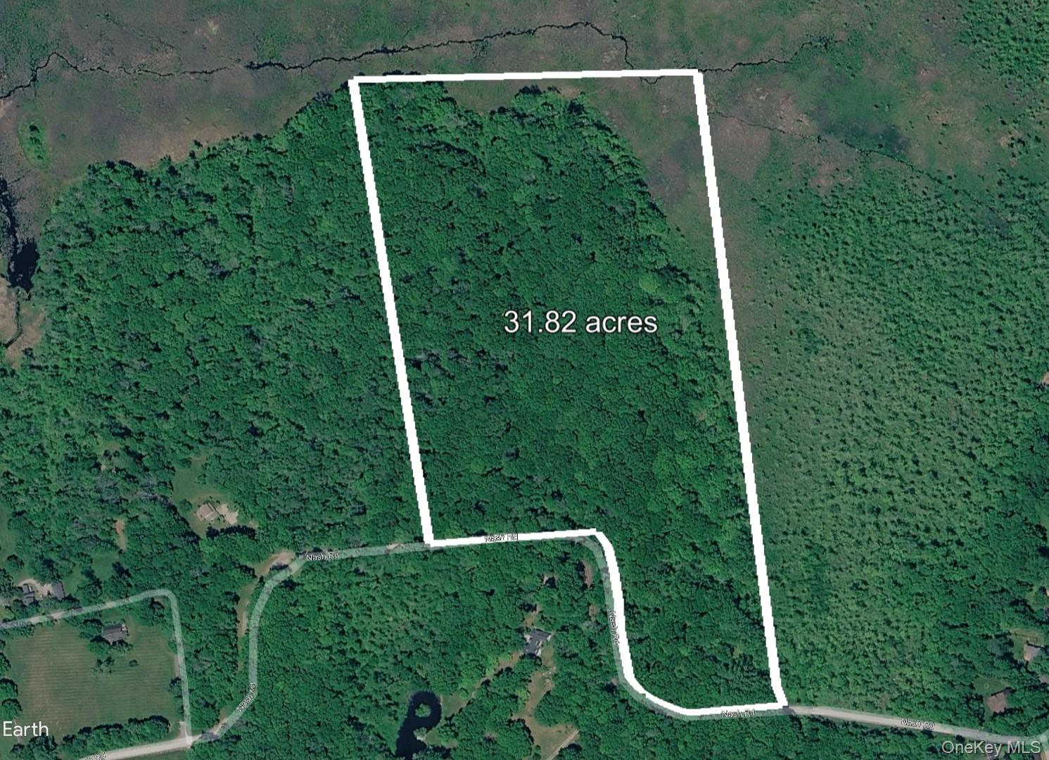 Discover serene privacy on this 31.82-acre wooded parcel along Nash Road in North Salem, New York.