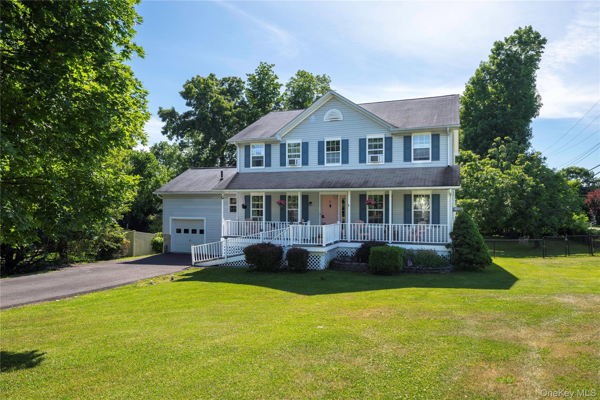 Two-story residence with attached single-car garage