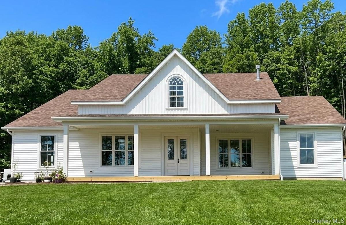 Depicts previously built farmhouse by same builders with unfinished front porch. All subject to change