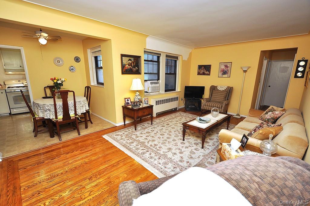 The large living room open to both the dining room and entrance foyer.  The living room has hardwood floors and is approx 20'-0\" x 12'-0\".