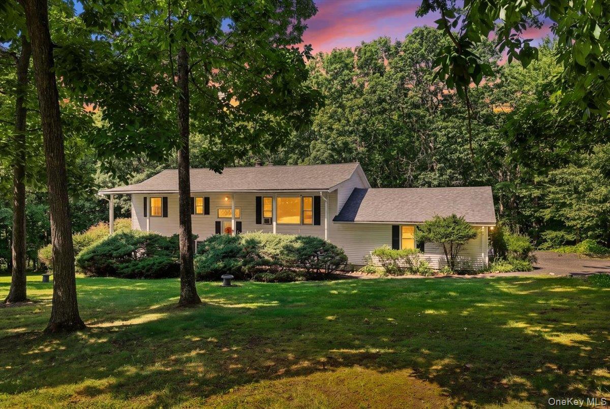 Stunning Colonial home on 1.6 acres bordering State forest.
