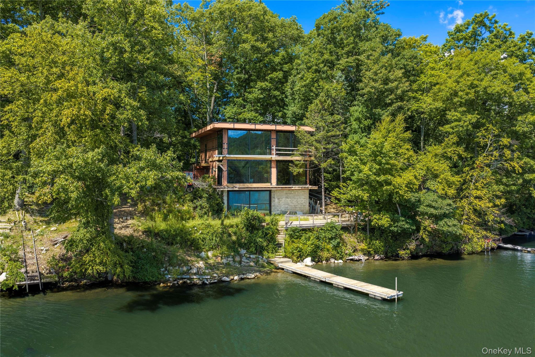 This is a once-in-a-lifetime opportunity to complete a modern architectural masterpiece on one of the most extraordinary settings imaginable—a private island in Whaley Lake.